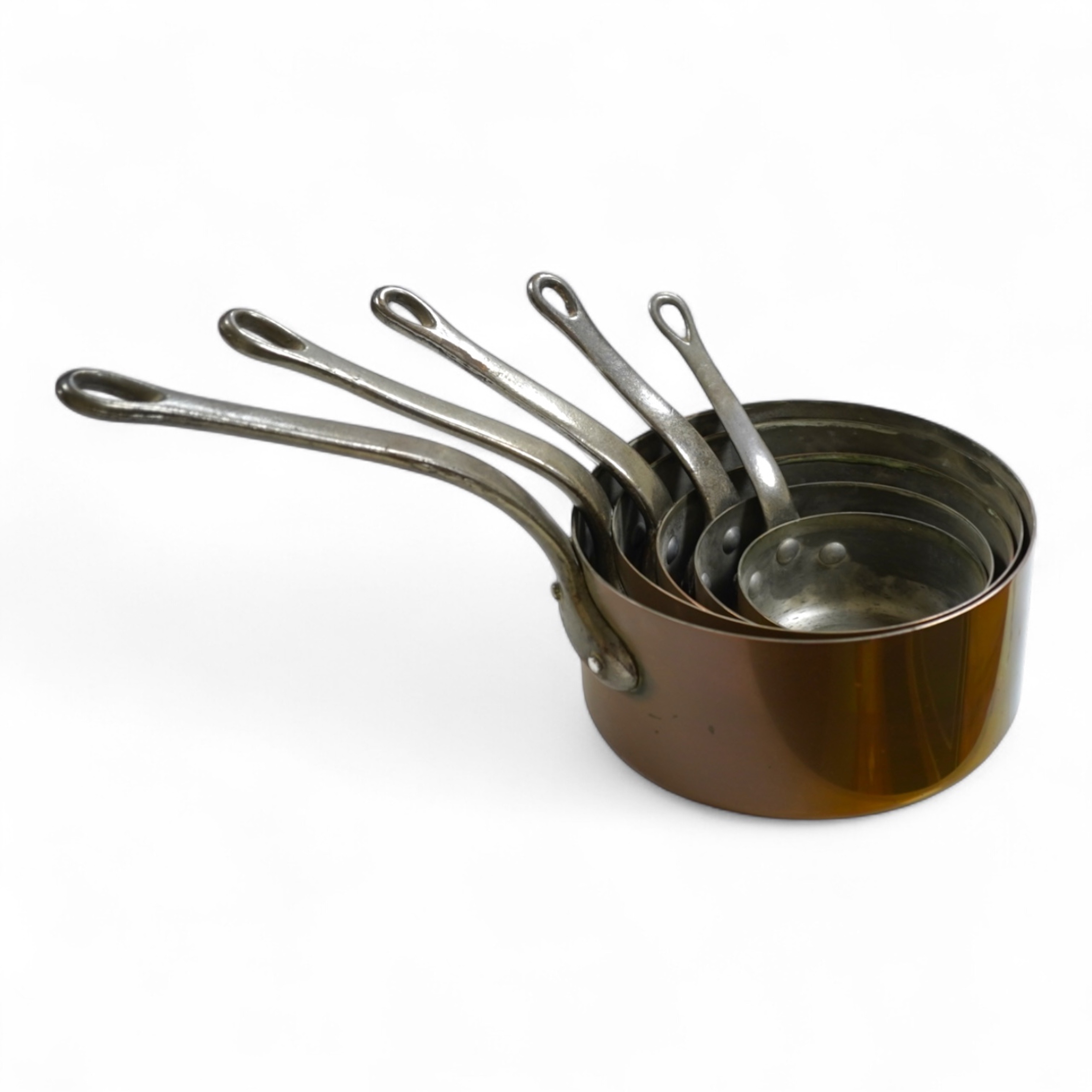 A graduated set of five French copper pans
